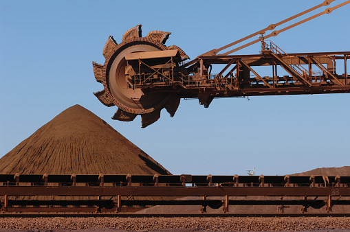 A reclaimer used to move stockpiles of crushed iron ore on a mine site.