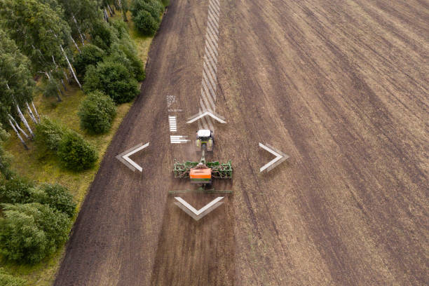 Autonomous tractor working on the field. Smart farming concept Autonomous tractor working on the field. Smart farming concept