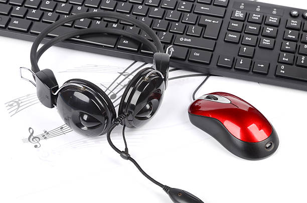 computer keyboard and headphone on music